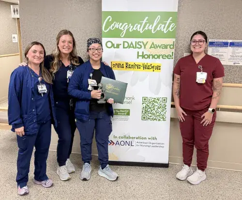 Photo, from left to right: Gloria Velez Mesiti, RN (Nurse on Women's and Children's); Anna Drocella, RN (Nurse Manager of Women's Health); Lorena Ramirez-Velasquez, RN (Nurse on Women's and Children's, DAISY Award winner); Victoria Garay, CNA (Nursing Assistant on Women's and Children's)