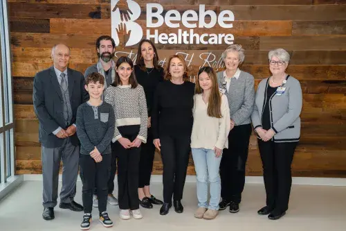 Photo of Dr. Saberi Scholarship recipients and family members, from left to right:  Back Row: Ezzi Saberi, brother of Dr. Saberi; Dylan Ortiz, son-in-law; Sudaf Saberi, daughter; Kay Young, Beebe Medical Foundation; Tracy Bell, SON Program Coordinator Front Row: Cameron Ortiz, grandson; Emily Ortiz, granddaughter; Shirin Saberi, widow; Olivia Creamer, scholarship recipient