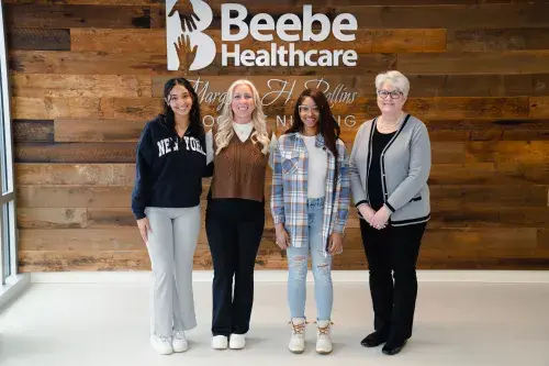 Photo of Medical Staff Scholarship recipients and leaders, from left to right:  Destiny Romano, MaKenna Miska, and Jamesia Alphonse, scholarship recipients; Tracy Bell.