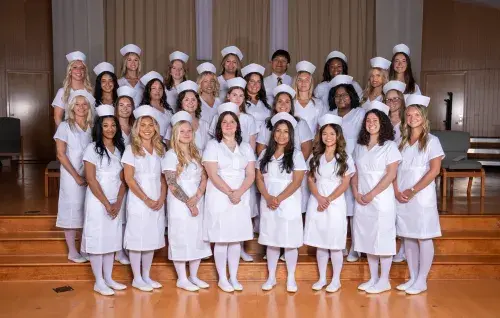 The Margaret H. Rollins School of Nursing Class of 2026 poses for a graduation photo.
