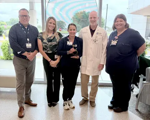 Photo, from left to right: James Lindquist (Director of Critical Care and Pulmonology); Tara Brancato (Non-Invasive Cardiology Manager); Arin Kluchnik (DAISY Award honoree); George Kluchnik (Hospitalist); and Beth Goins (Nurse Manager of Clinical Decision Unit and Orthopedics, 3rd Surgical Rehoboth Specialty Surgical Hospital, and Inpatient Wound Care).