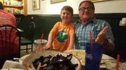Image file: In our experience, there are strong inherited traits between grandparents and grandkids - including the LOVE of seafood! Here Pops (Ken) enjoys mussels with seafood-loving Alex.
