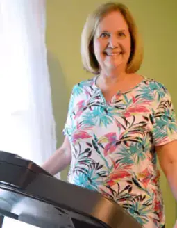 Image file: Beth Reynolds exercises on a treadmill at home