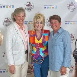 dpil insta crop.jpg Dolly Parton, Kay Young and wife, Donna Shifflett, representing Beebe Healthcare at Wilmington Event