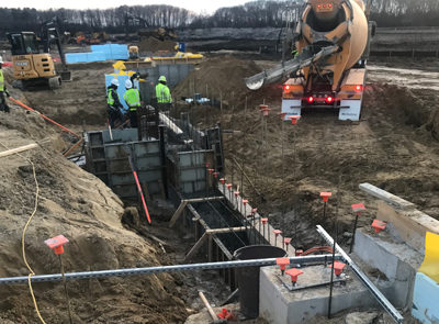 Crew pouring concrete