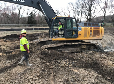 Work crews moving dirt